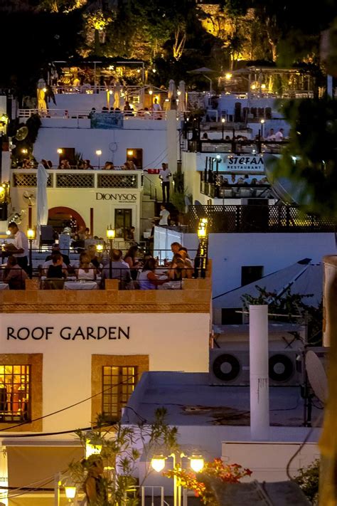 The Bars and Restaurants all lit up at night in Lindos Rhodes Greece | Visiting greece, Places ...