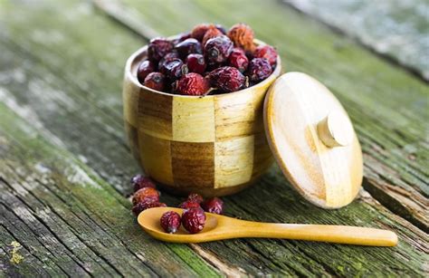 Premium Photo | Dried berries in a wooden pot on the table