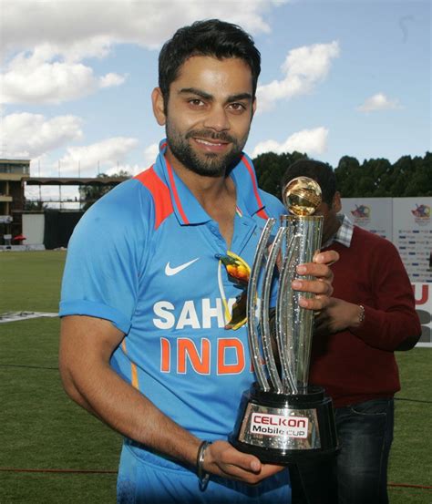 Virat Kohli with the trophy | Virat and anushka, Virat kohli, Banner background images