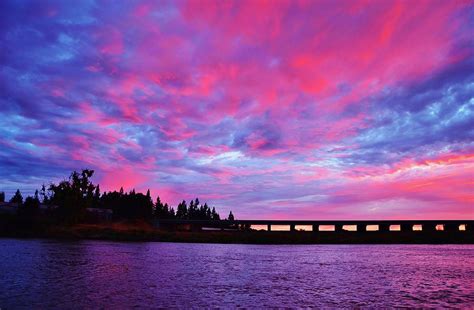 Pink Cloud Invasion Sunset Photograph by Marilyn MacCrakin