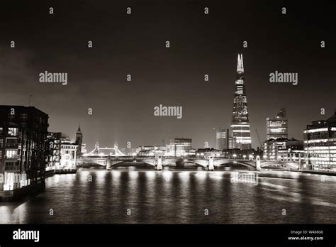 Southwark Bridge and London skyline at night Stock Photo - Alamy