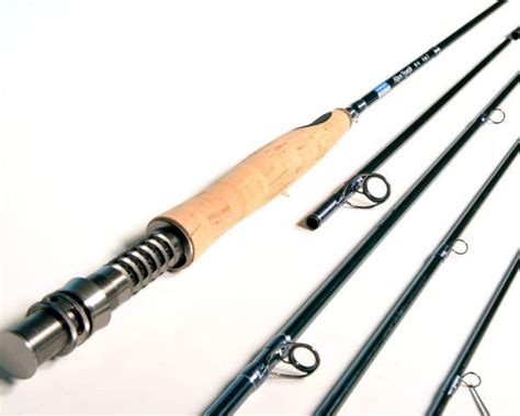 four fishing rods are lined up next to each other on a white surface ...