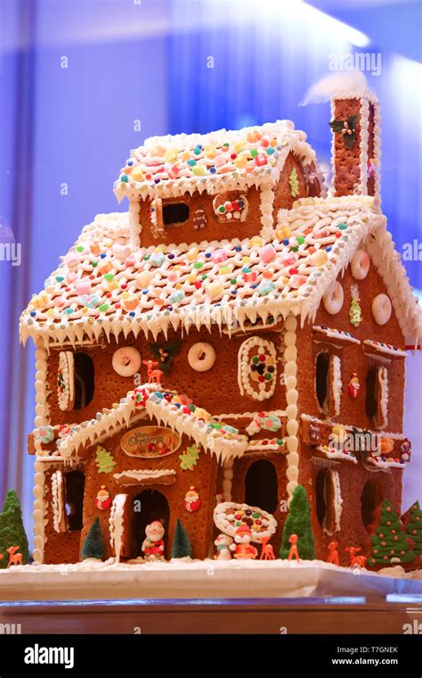 Hand crafted christmas cookie house using gingerbread biscuit and jelly ...