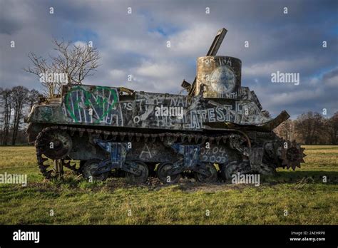 Old tank with graffiti Stock Photo - Alamy