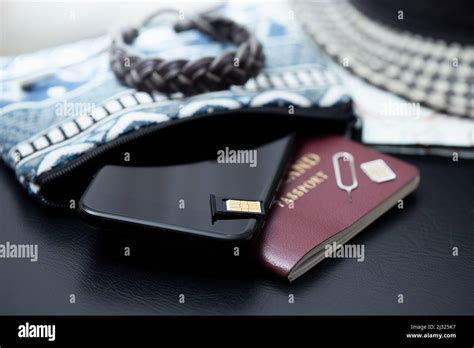 SIM card for smart phone. Changing the SIM card Stock Photo - Alamy