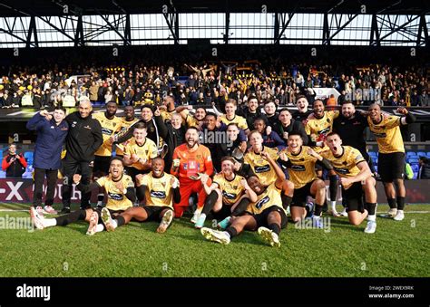 Maidstone United players and staff celebrate the win after the Emirates ...