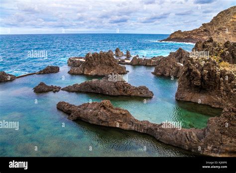 Porto moniz with natural swimming pools hi-res stock photography and ...