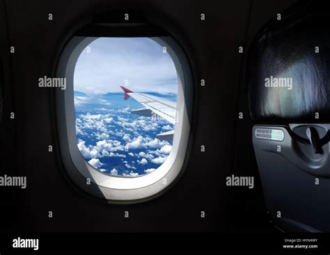 Airplane window seat with view Stock Photo - Alamy