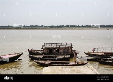 Boats by the Ganges river in Varanasi city Stock Photo - Alamy