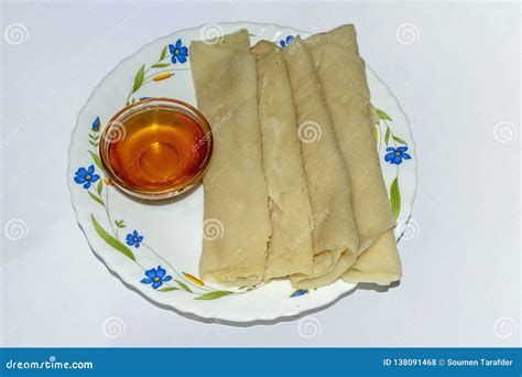 Bengali Cuisine - Patishapta Pitha with Jaggery Syrup on a Bowl Stock Photo - Image of coconut ...