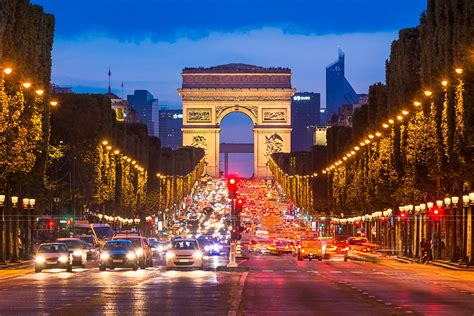 Avenue des Champs Elysees - Night view of the Arc de Triomphe and the famous Avenue des Champs ...