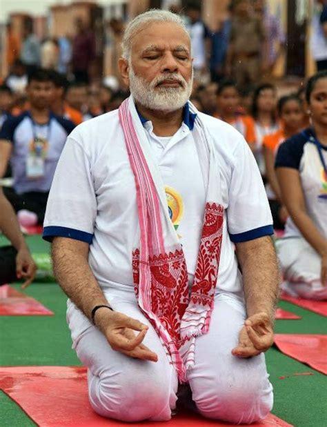 Even the rains can't stop Modi from doing yoga - Rediff.com India News