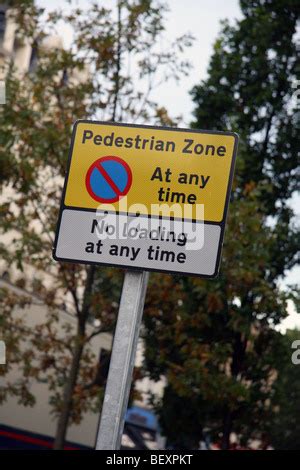 Sign Pedestrian Zone parking restriction At Any Time Stock Photo - Alamy