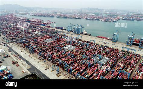 QINGDAO, CHINA - APRIL 13, 2022 - Freighters rush in and out of qianwan ...