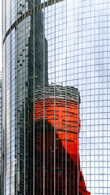 Reflection in Glass Wall of Building · Free Stock Photo