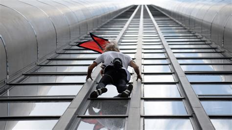 In pictures: 'French spiderman' scales Paris skyscraper