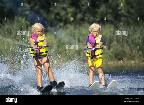 two children water skiing Stock Photo - Alamy