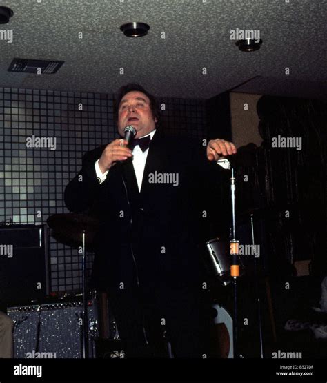 Bernard Manning on stage with microphone August 1981 Stock Photo - Alamy