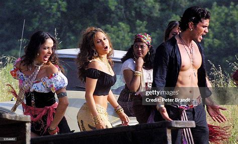 Singer Jennifer Lopez, second from left, films a scene with her crew ...