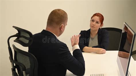 Business Partners Communicate in Sign Language. a Deaf Boss Gives a Task To a Subordinate Woman ...