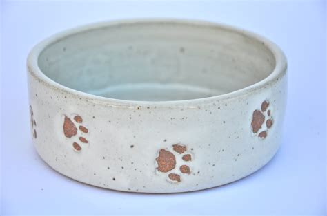 Small ceramic dog bowl with paw prints white pottery dog