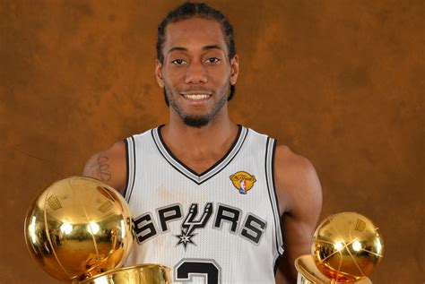 320x568 resolution | photography of Kawhi Leonard holding two trophies ...