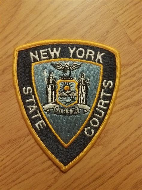 New York State Police Patch on Wooden Surface