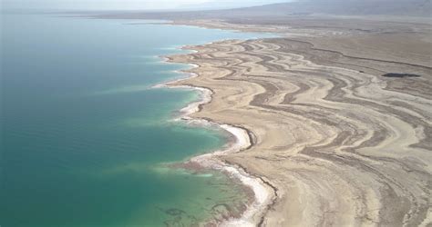 Aerial view of beautiful rock formation and sinkholes along Dead Sea ...