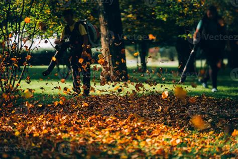 People operating a heavy duty leaf blower. 11530754 Stock Photo at Vecteezy