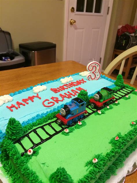 Thomas cake with buttercream icing & toy trains. Thomas Birthday Cakes, Thomas Birthday Parties ...