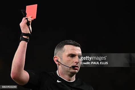 Referee Michael Oliver shows a red card to Manchester United's... News ...