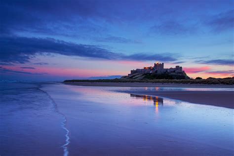 Bamburgh castle at sunset, Northumberland coast, England. UK