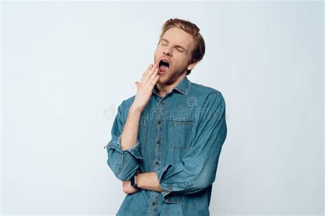 Portrait Of Tired Sleepy Young Man Yawning Stock Photo - Image of ...