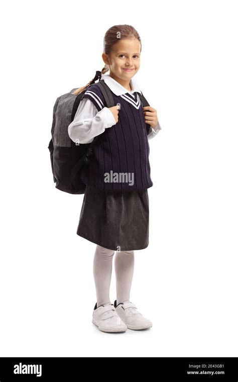 Full length portrait of a smiling schoolgirl in a uniform isolated on ...