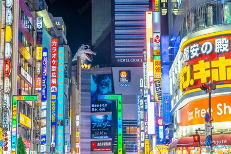 Shinjuku district Illuminated by Neon Signs at twilight in Tokyo Stock ...