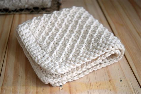 Hand Knit Daisy Stitch Washcloth Pattern • Nourish and Nestle