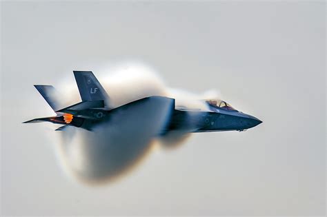 USAF F-35A with vapor cone during a high speed pass at the Canadian International Air Show ...