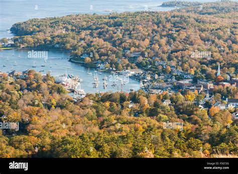 A birds-eye-view of Camden Harbor and surrounding fall foliage from Mt. Battie in Camden, Maine ...