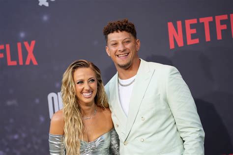 Patrick Mahomes and Wife Brittany Kiss Super Bowl Trophy - Parade