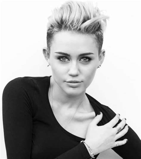 Miley Cyrus Heart Tattoo on her Finger - Meaning and Story Behind It