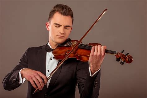 Premium Photo | The young musician man playing violin