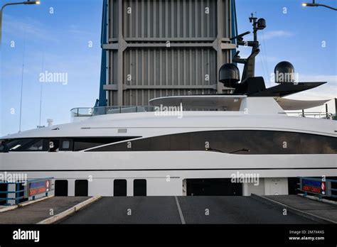 Simpson Bay, Sint Marten - January 2023: Superyachts creep through the narrow bridge opening at ...