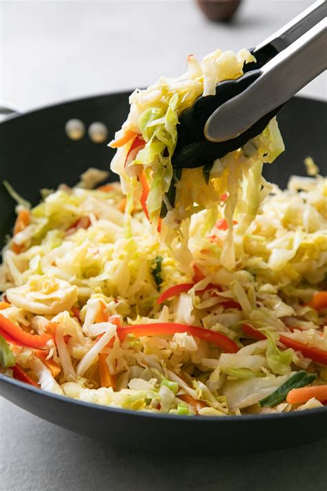 Cabbage stir fry recipe with red bell pepper, carrots and green onions seasoned with a light and ...