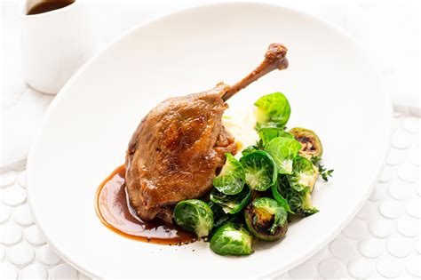 Confit Duck Legs with Garlic Mash & Brussel Sprouts — Angelakis Bros