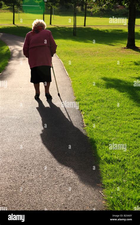 Old lady walking stick hi-res stock photography and images - Alamy