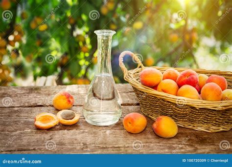 Fruit Brandy in a Bottle and Fresh Apricots Stock Image - Image of liqueur, orange: 100720309