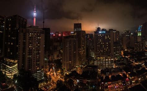 Premium Photo | Illuminated menara kuala lumpur tower in city at night