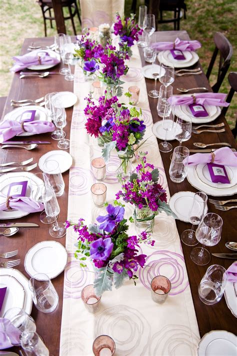 i can see this with aquamarine napkins and orange and blue flowers included with the purple ...
