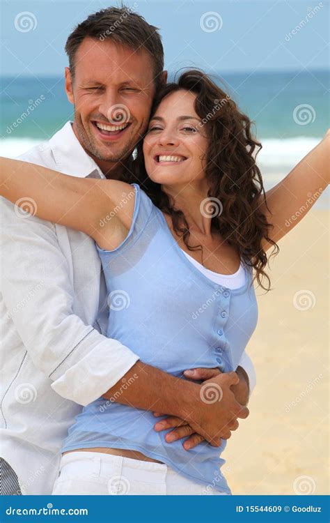 Smiling Couple at the Beach Stock Image - Image of handsome, beautiful ...