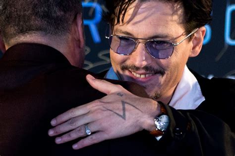 Johnny Depp shows off diamond 'chick's ring,' indirectly confirming engagement rumours | CTV News